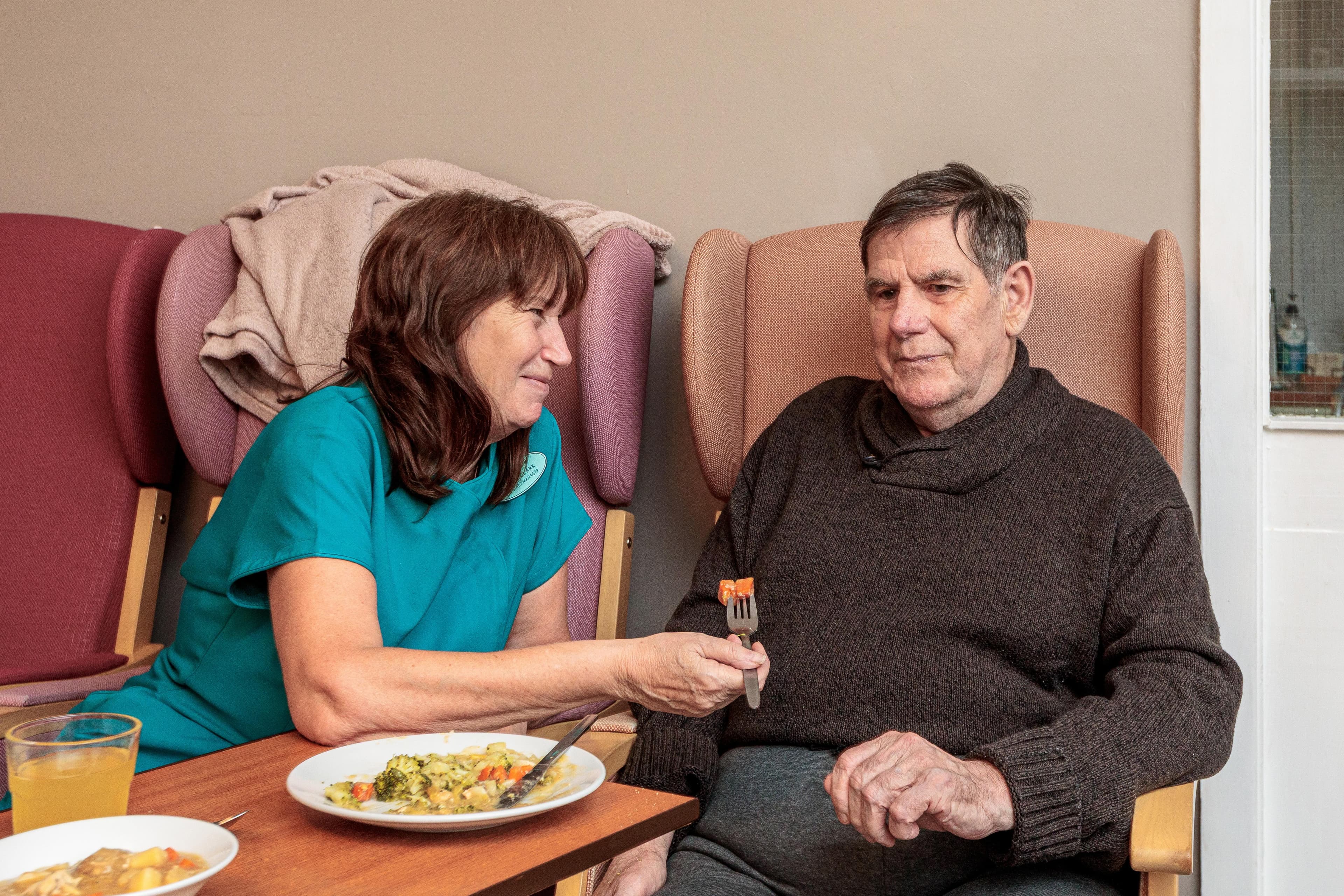 Staff member helping a resident