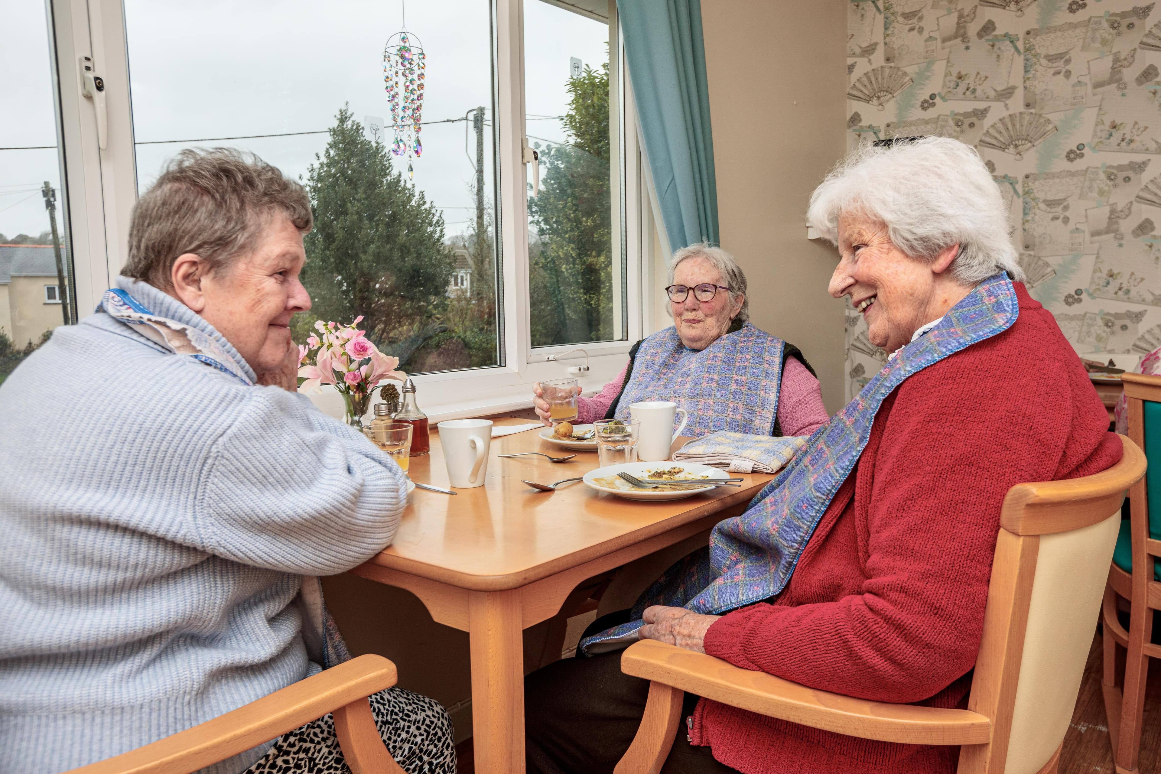 Residents chatting at the dining table