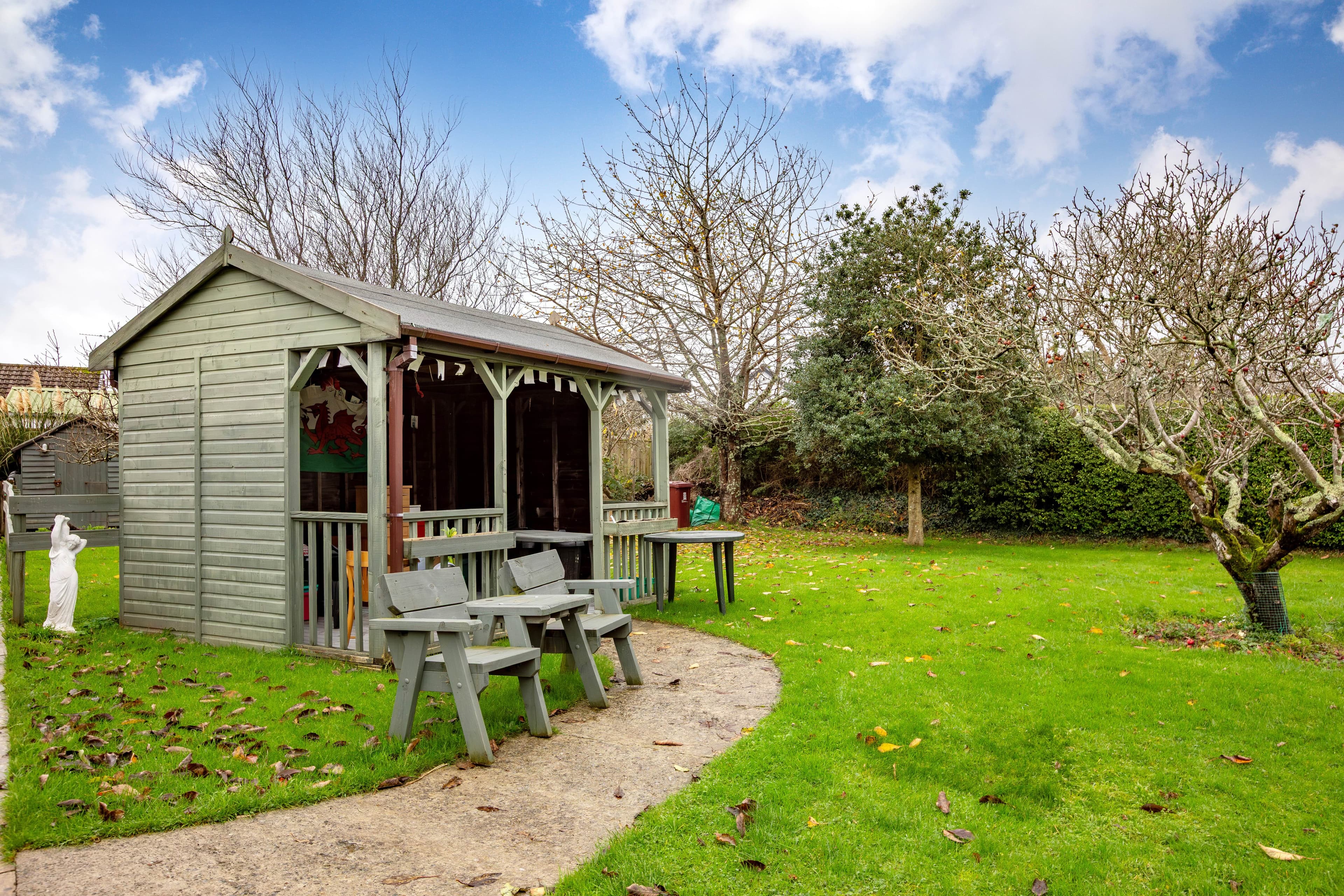 Garden with covered shelter and lawn